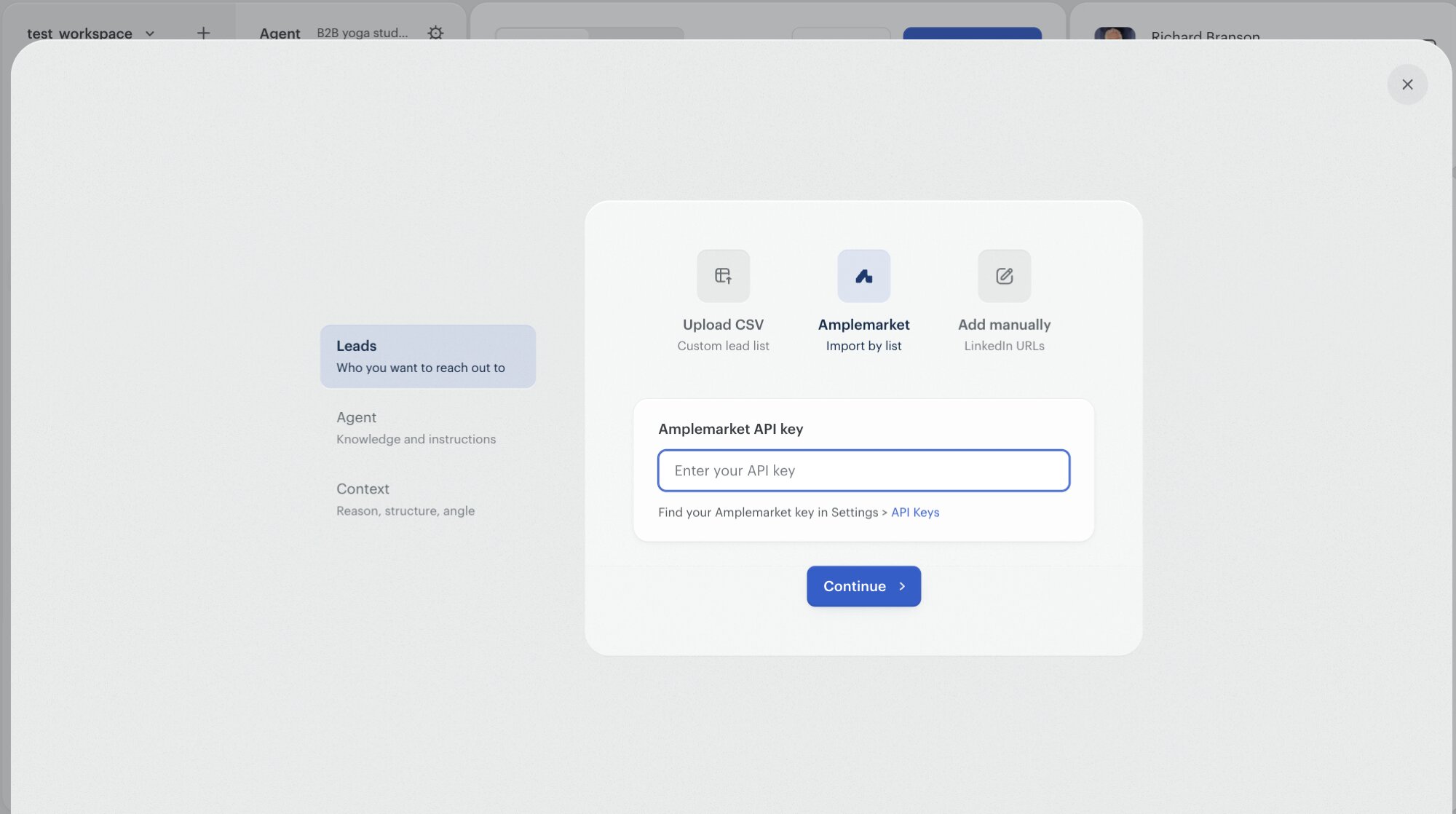 The Twain campaign-creation Leads step with Amplemarket selected as the source. A card titled 'Amplemarket API key' shows an empty text field with placeholder 'Enter your API key' and a helper link 'Find your Amplemarket key in Settings > API Keys'. A Continue button sits below.