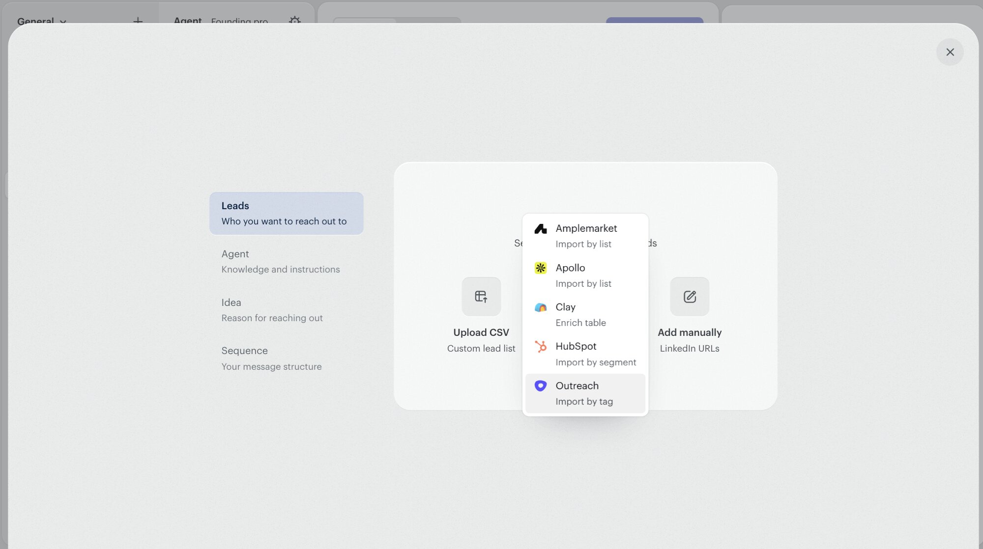 The Twain campaign-creation lead-source picker with the dropdown open. Outreach is highlighted at the bottom with the caption 'Import by tag'. Amplemarket, Apollo, Clay, and HubSpot are listed above it.